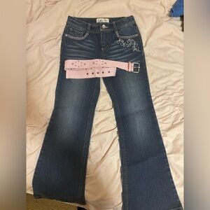 lei low rise flared jeans with pink detailing and belt